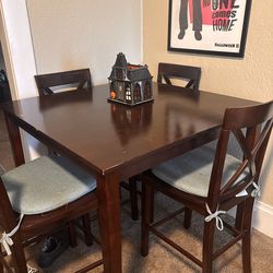 table and 4 chairs with cushions