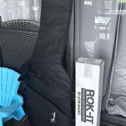 Guitar Carrying Bag And Guitar Rack