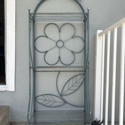 Vintage metal plant stand with flower design