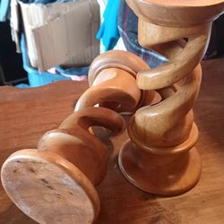 A Pair Of Hand Carved Wooden Candle Sticks