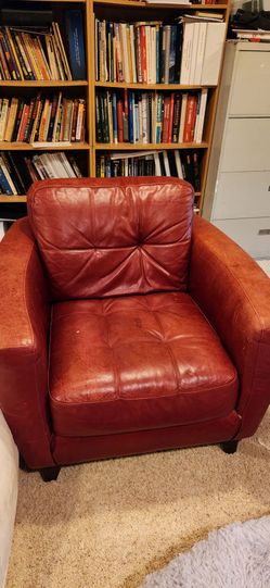 2 red leather chairs
