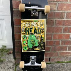 Shrunken head skateboard