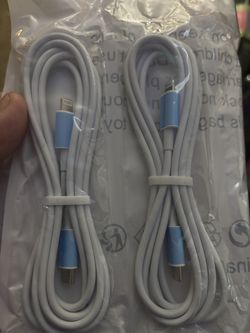 2 I phone white USB-C to Lightning cables, likely for charging and data transfer with Apple devices
