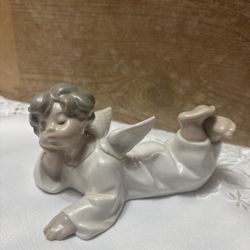 Lladró "Angel Laying Down" porcelain figurine, model number 4541.