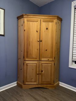 solid wood corner entertainment center / TV armoire.
