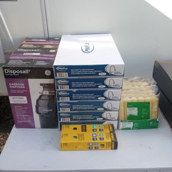 Two New Garbage Disposals, 6 Pro Flow Kitchen Faucets, Six Bundles Of Semi Smooth 1/2 Inch Naps, Two Boxes Of 15 Gauge 2 And 1/2 In DeWalt Finish Nail