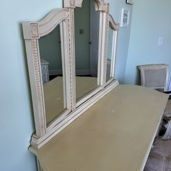 Jaclyn Smith Largo Antique White vanity set featuring a trifold mirror and an upholstered Chair - 53” x 22” x 64”