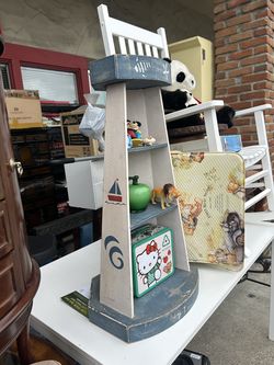 lighthouse-themed wooden corner display shelf used for storing and showcasing small collectibles