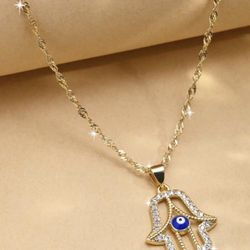 Gold Hamsa Necklace with Blue Eye Pendant
