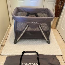 NUNA MINI PLAYPEN/ PLAY YARD COLOR IS GRAY 