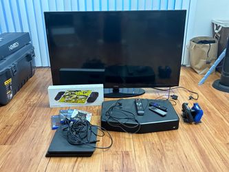 50 inches Samsung TV with Roku and flat surround speaker with PS4 bundle and games. Ipad hand held controller.