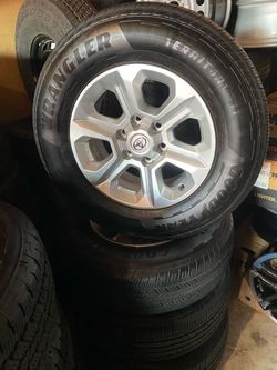 New 2023 4Runner SR-5 17” Alloys W/New Freshly installed  2026 Goodyear wrangler HT Territory’s size 245 70 R 17”  flawless  nice on any older Tacoma.