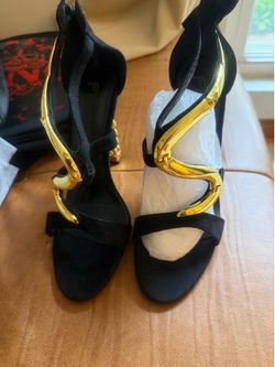 Brand new!! Black and Gold Size 10 women shoes