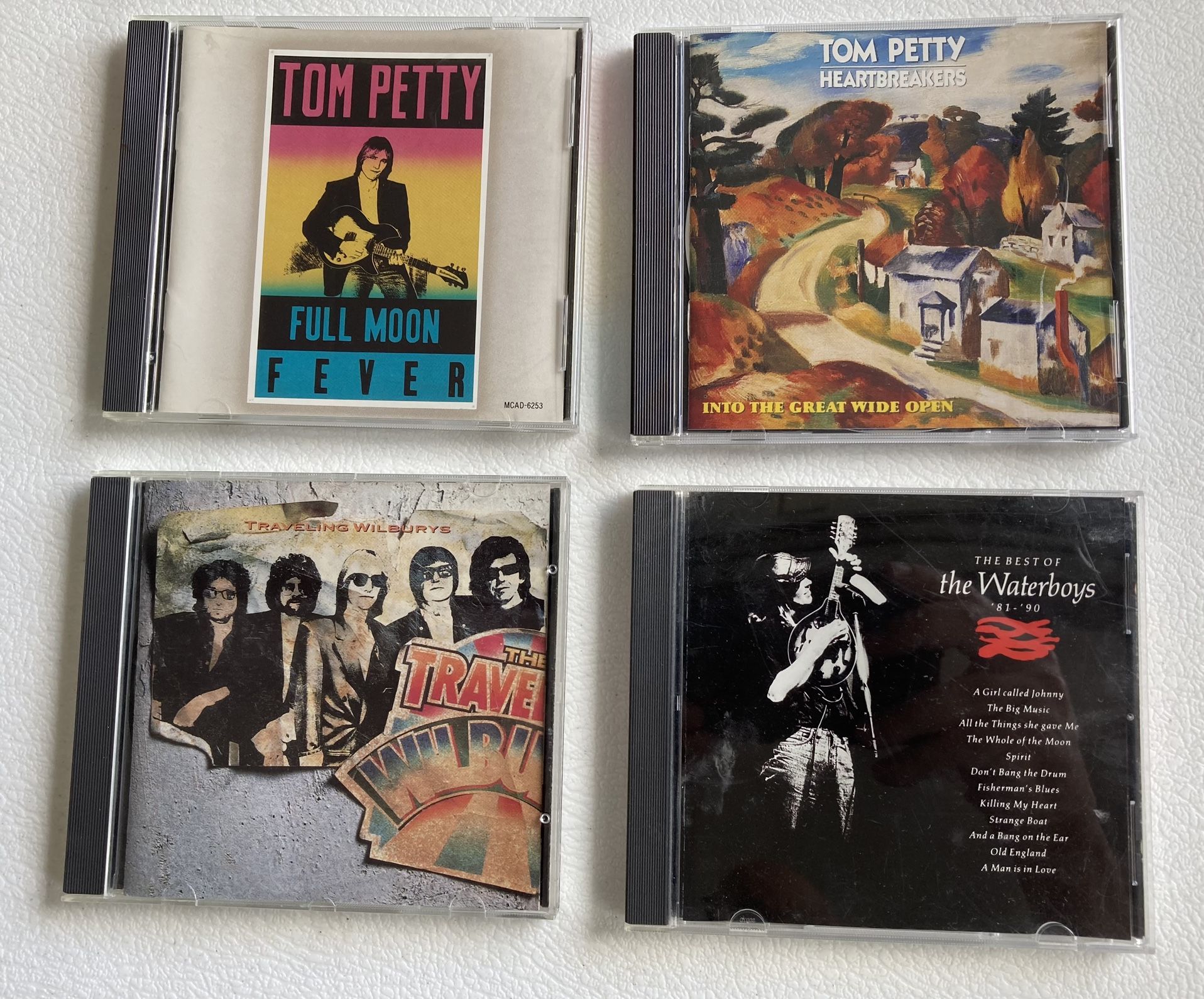 Set Of All 4 Tom Petty And Traveling Wilburys And The Waterboys CDs.