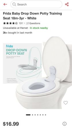 Drop down potty seat