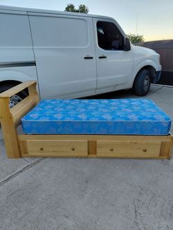 Twin captain's bed with bookcase headboard and storage drawers