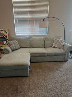 2-piece rchaise sectional with pop up sleeper. OK CONDITION