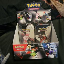 $50 for 2 tins and display box Pokemon 