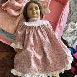 American Girl Doll With Case And 9 Outfits.$50