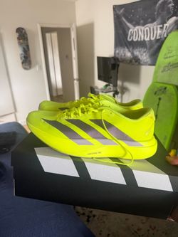 Adidas Adizero Evo SL running shoes in a neon yellow