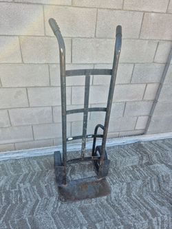 HEAVY DUTY DOLLY WITH SOLID TIRES, IN GOOD CONDITION