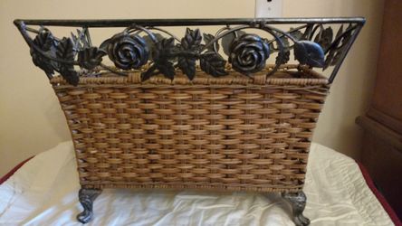 Vintage cast and wicker planter .