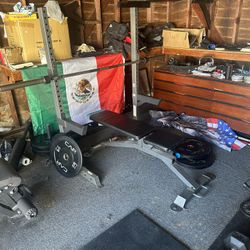 Squat Rack And Adjustable Bench With Barbell And Weights 