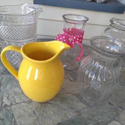 Asst Flower Vase Pitcher 1.00 each  Yellow 7 1/2" Golden Harvest Bottle w/lid 9" pink ribbon 8 1/2 swirl 8"  Pressed glass pitcher 5.00  Bristol Boro,