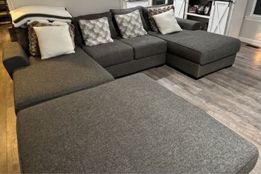 Gray sectional sofa with large ottoman