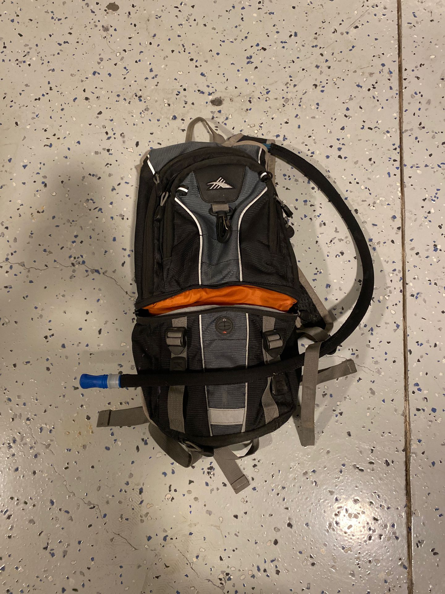 High Sierra Light Weight Hiking backpack With thermal vest on water tube.