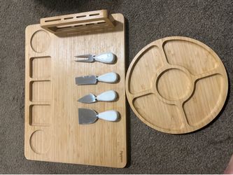 Bamboo charcuterie board with knives