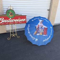 Beach umbrella and vintage sign priced in a bundle