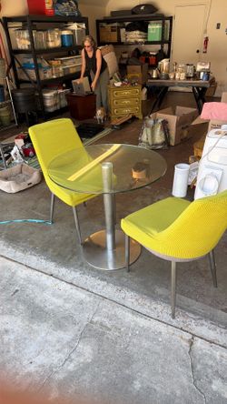 Glass table and two chairs