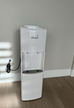 Primo top loading water dispenser (three 5 gallon bottles included with in the price)