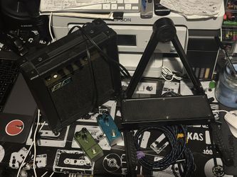 Amplifier, guitar stand, two pedals, two TRS cables, and one footrest.