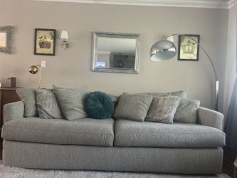 two-seat upholstered fabric deep sofa with accent pillows