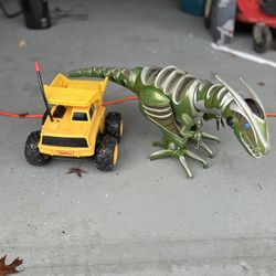 Vintage Toy Bundle – Tonka Dump Truck & Robo Raptor 🦖🚜  Includes: • Tonka Yellow Dump Truck – classic, old-school toy • WowWee Robo Raptor Robot Din