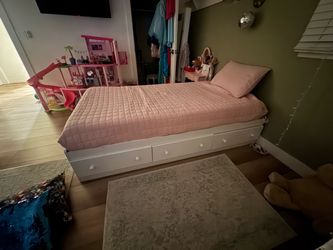 2 White twin beds with storage drawers