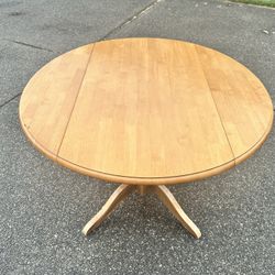 Round  Wooden Table With Dropped Leaf Sides
