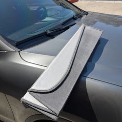 Pre-owned OEM 2015-2017 Porsche Cayenne windshield visor.