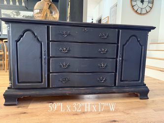 Two antiqued black dressers