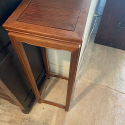 Rosewood stand for displaying items or plants.  36” H12” square top.