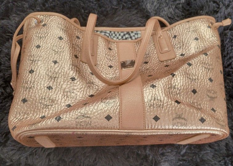 Gold MCM tote bag.