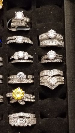 Tons of wedding sets for sale a ll different styles all different prices and all different sizes.