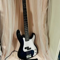 Glarry Precision-style electric bass with a small Glarry practice a