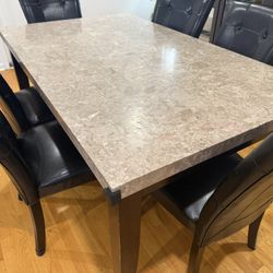 Rectangular Faux Marble Dining Table with Black Upholstered Chairs