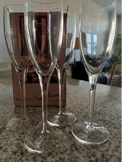 Set of four 7-ounce blown crystal champagne flutes by Rigoletto Luigi Bormioli