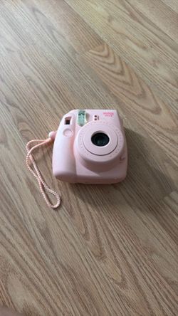 Pink instax mini camera and Minnie Mouse bag