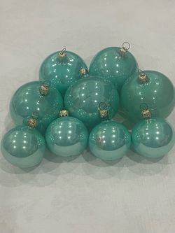 9 teal shiny Christmas ball ornaments with gold caps. 5 - 3 inch & 4 - 2 inch