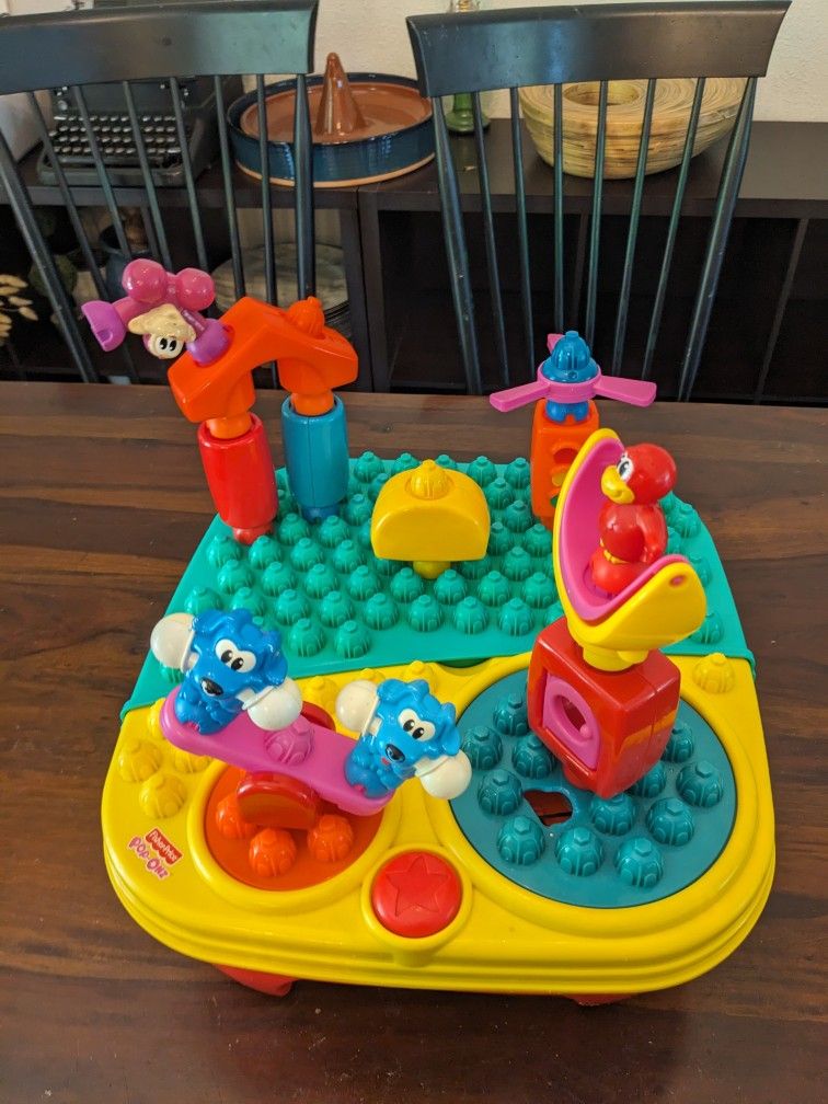 FISHER-PRICE "POP-ONZ POP'N TWIRL SPIN MUSICAL BUILDING TABLE"
